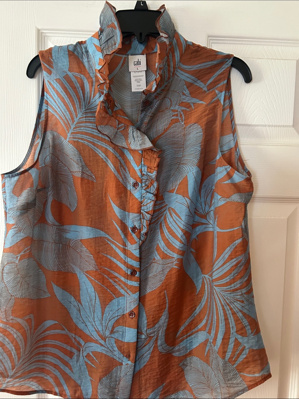 CAbi Sleeveless Ruffled Collar Tropical Leaf Print Top in Rust & Light Blue